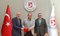 BŞEÜ'ye gümüş madalya ve madalya beratı takdimi