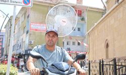 Kırşehir'de sıcaktan bunalan vatandaş, elektrikli motoruna vantilatör taktı