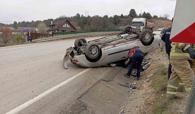 Takla atan otomobilden yara almadan kurtuldu