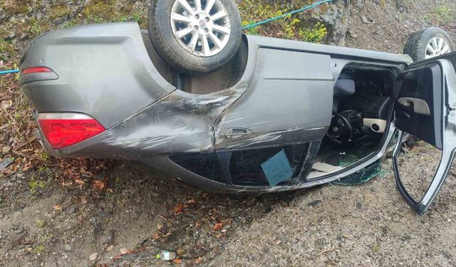 Takla atan otomobilden yara almadan kurtuldu